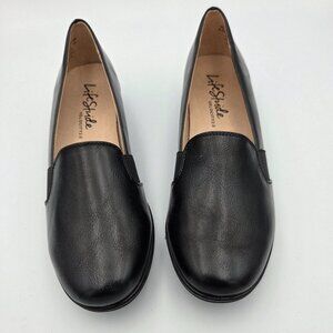 Life Stride 8.5W Black Leather Slip On Round Toed Shoe w/1.5" Wedge Heel.